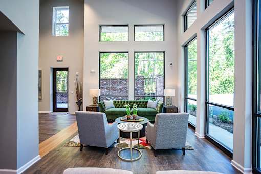 A living room with a couch, chair, and table.