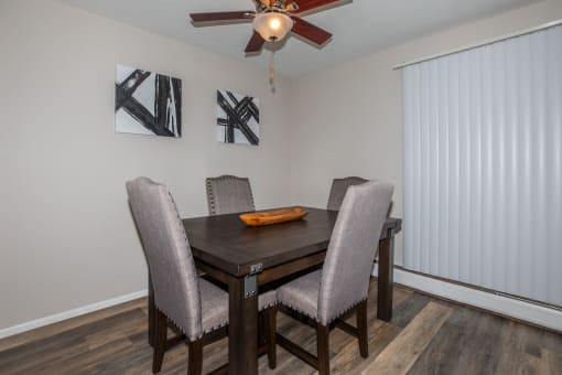 this is a photo of the dining room in a 2 bedroom apartment at deer hill apartments in