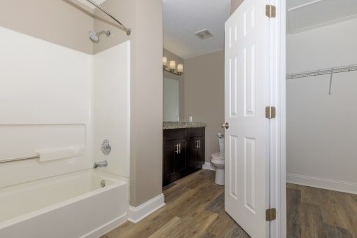 a bathroom with a bathtub and a sink