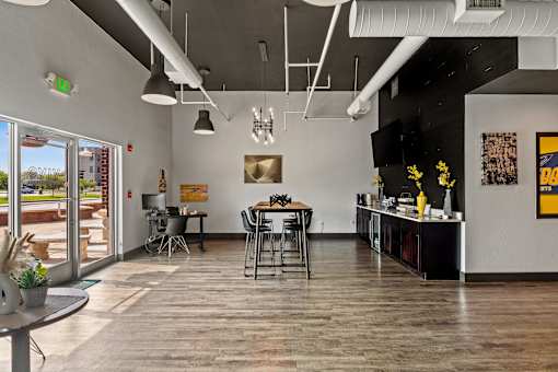 A modern interior with a dining area and a kitchenette. at Vivo Toledo Apartments, Toledo, OH