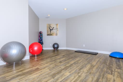 the spacious exercise room at the whispering winds apartments in pearland, tx