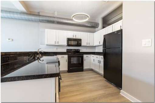 a kitchen with granite countertops at Marshall Place