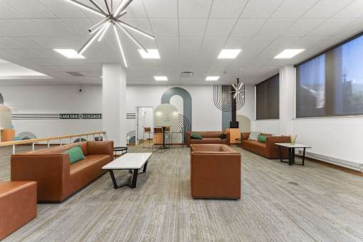 A modern office space with brown and green furniture.