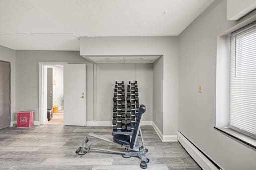 a room with a chair and a lot of tires in it