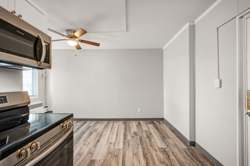 the renovated kitchen and living room in a new home