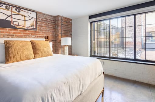 bed, two pillows and a window at Life At Agora, Ohio
