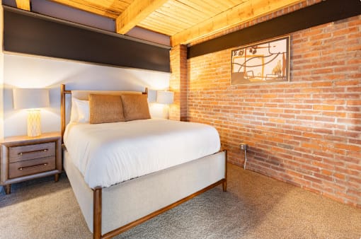 bedroom with nightstand, and lamp at Life At Agora, Cleveland