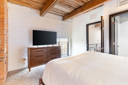 bedroom with a bed and TV at Life At Agora, Cleveland