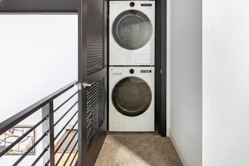 washing machine is in a small room at Life At Agora, Cleveland, 44103