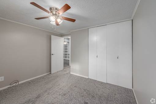 bedroom with ceiling fan at andover courtyard