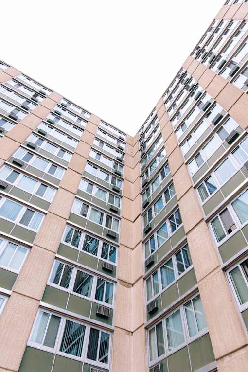 Two buildings with windows facing each other.