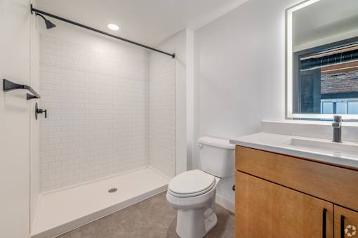 white toilet sits in bathroom at Life At Agora, Cleveland, OH
