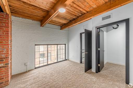 room with a brick wall at Life At Agora, Cleveland Ohio