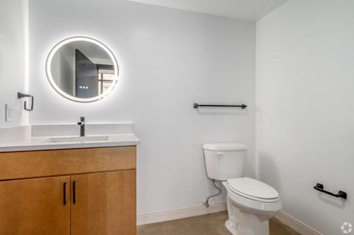 white toilet sits next to a sink at Life At Agora, Ohio, 44103