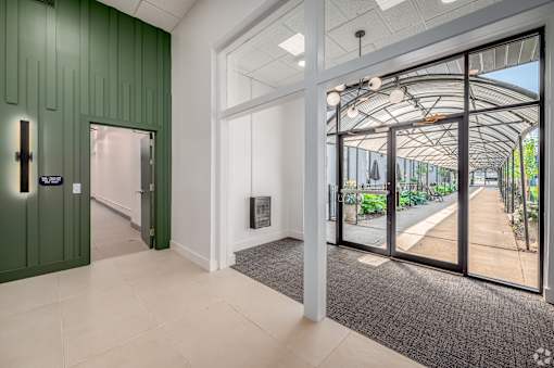 hallway with a green door at Life At Agora, Ohio