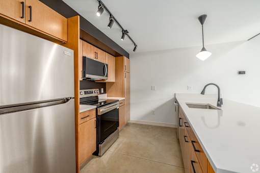 modern kitchen with fridge at Life At Agora, Cleveland, OH