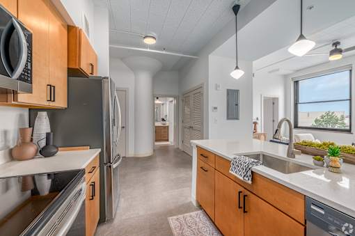 kitchen with wooden cabinets at Life At Agora, Ohio, 44103