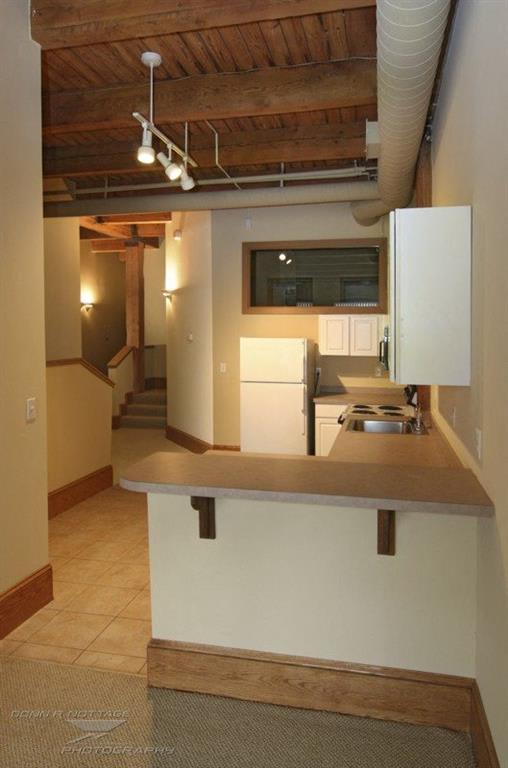 a kitchen with a counter top and a stove top oven
