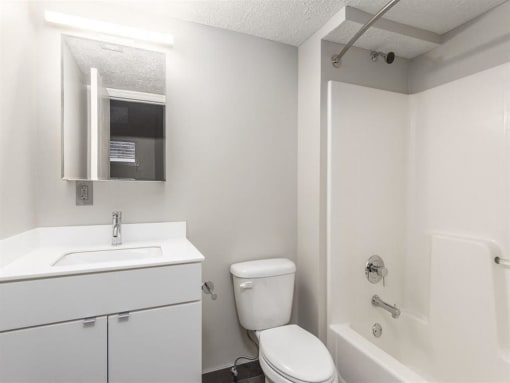 a bathroom with a toilet sink and bathtub