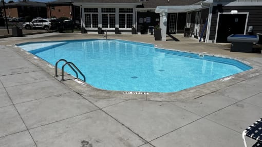 a swimming pool in the middle of a hotel pool at Heritage Apartments, Columbus, 43212
