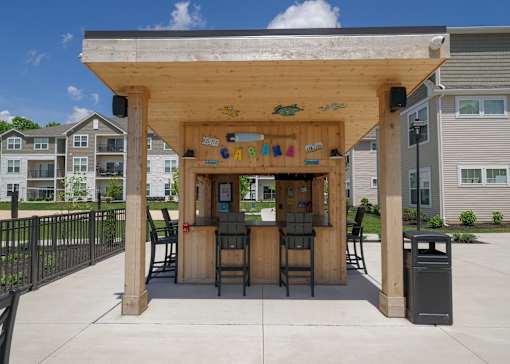 the covered outdoor bar at the clubhouse at the crossings at walnut grove apartments at The Bend, Lancaster, Ohio
