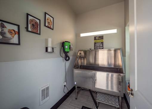 a patient room with a surgery machine and a green phone on the wall at The Bend, Lancaster, Ohio