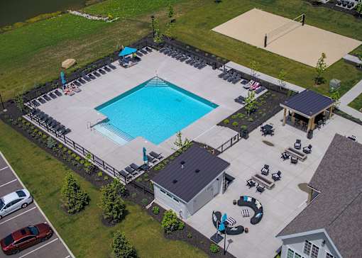 an aerial view of a swimming pool in front of a house at The Bend, Lancaster, Ohio