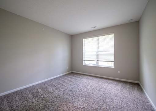 an empty room with carpet and a window at The Bend, Lancaster, Ohio
