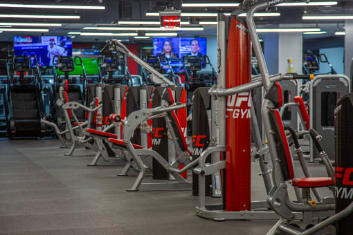 a row of exercise machines at UFC Gym equipment at Market Square Place, Pittsburgh, PA at Market Square Place, Pennsylvania