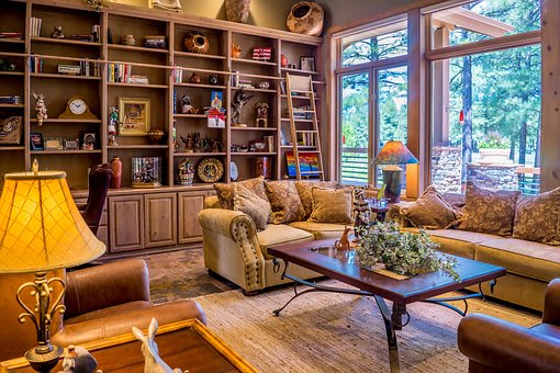 a living room filled with furniture and a large window