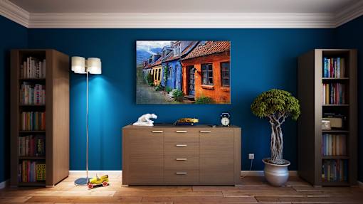an image of a room with a painting on the wall