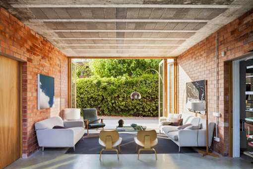 a living room filled with furniture and a large window