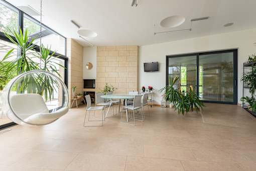 a room filled with furniture and a large window