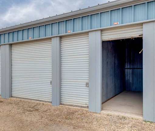 A storage facility with two open doors.
