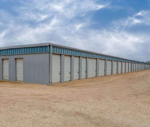 A long row of storage units with closed doors.