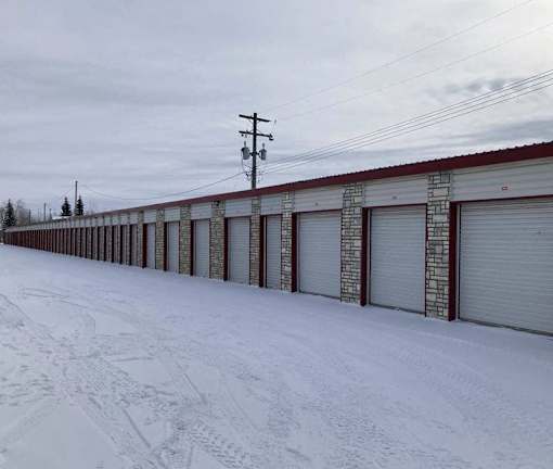 A long row of garage doors are closed.