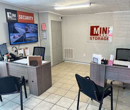A storage office with a security sign on the wall.