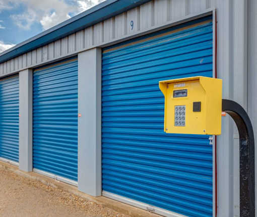 A yellow box is attached to a blue storage unit.