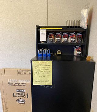 a refrigerator with a box on top of it