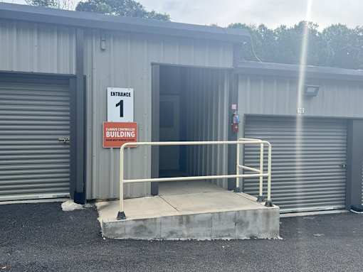 A building with a sign that says "Entrance 1" is shown.