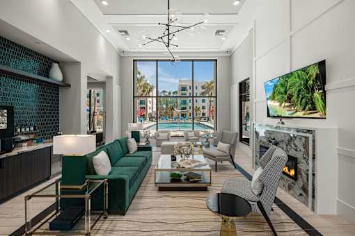 A Living Room with a Green Sofa at The Palmeri Residences, Florida, 34104