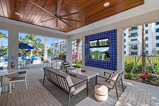 Outdoor Lounge with TV at The Palmeri Residences, Naples, Florida