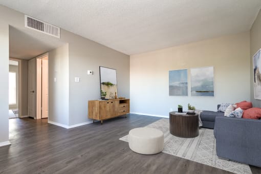 Renovated homes feature wood-style plank flooring at Acacia Gardens, Albuquerque