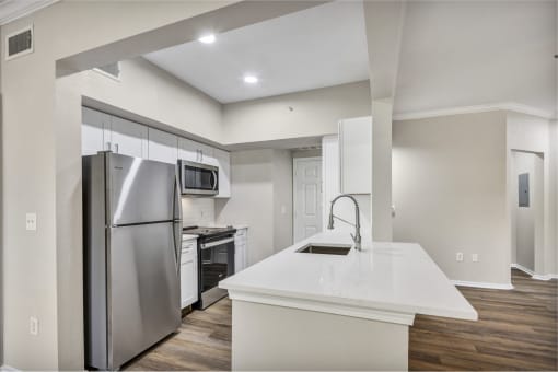 Renovated deluxe home featuring white cabinets and stainless steel appliances at The Lodge at Lakeline Village, Cedar Park, 78613