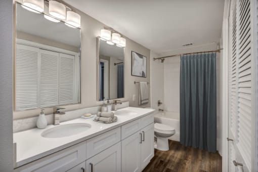 Renovated deluxe home featuring wood plank flooring and designer lighting fixtures at The Lodge at Lakeline Village, Texas