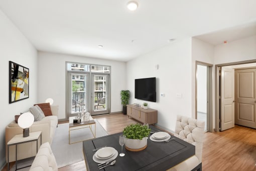 a living room with a couch and a table at Glenwood at Grant Park Apartments, Atlanta, Georgia