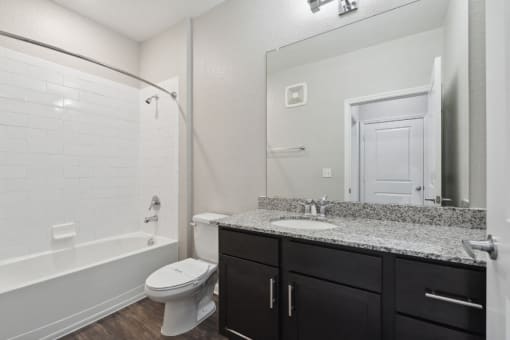 Bathroom with a Shower, Bathtub, Toilet, Sink, and a Mirror at Village at Terra Bella Apartments, FL