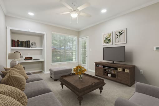 a living room with a couch and a tv