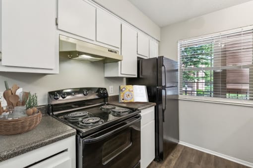 our apartments offer a modern kitchen with stainless steel appliances at Acacia Gardens, Albuquerque, NM, 87111