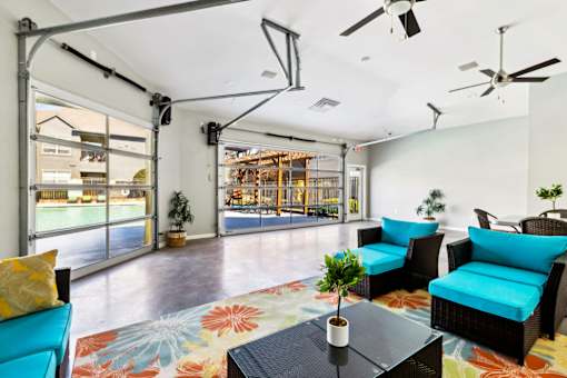 A Living Room with a Blue Couch at Flats on Chapel Apartments, Waco, 76712